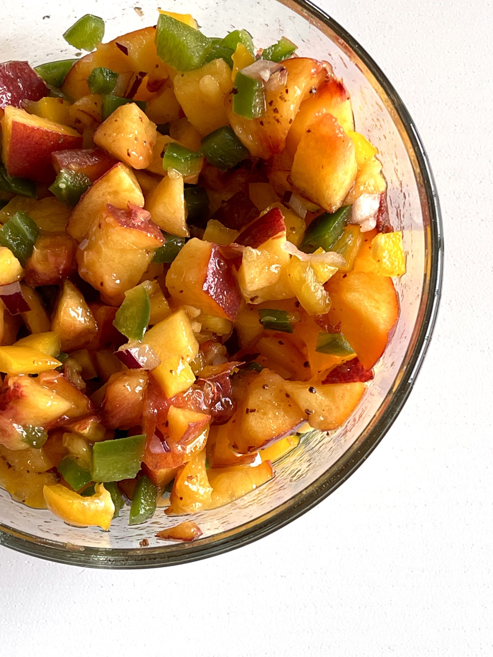This homemade peach salsa is a quick and easy fruit-based salsa to enjoy all summer long. Enjoy it with potato chips or served on top of your favorite protein (chicken would be delightful). | just the recipes, please